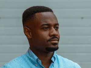 black man in blue polo