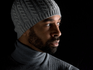Man in gray trousers and gray bonnet