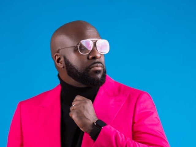 Black man in pink coat