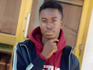 Young black man wearing Blue jacket