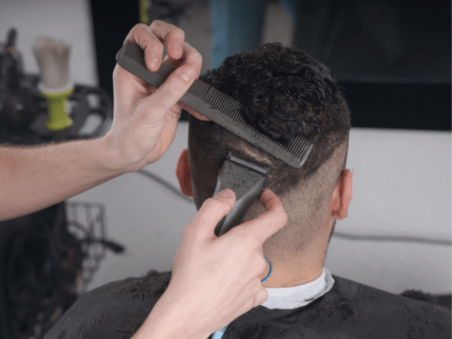 Man getting a fade haircut