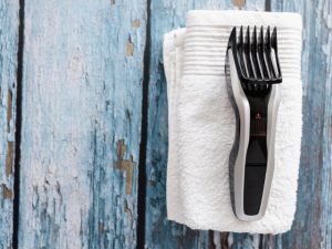 black hair clipper on a white towel