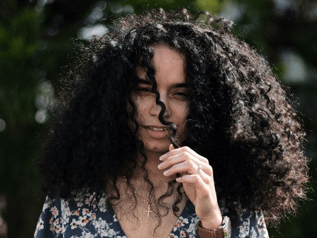 person with curly hair