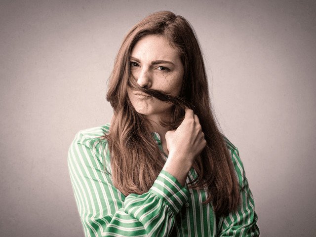 woman smelling her hair