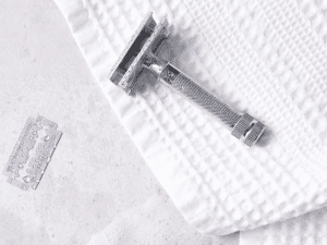Safety razor on a white towel