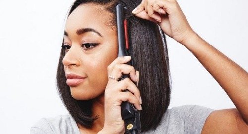 Woman with flat iron
