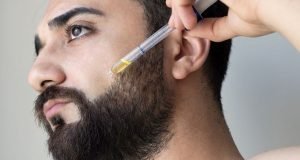 Man applying beard oil