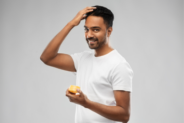man applying hair gel - featured image