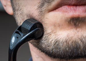 guy using derma roller - featured image